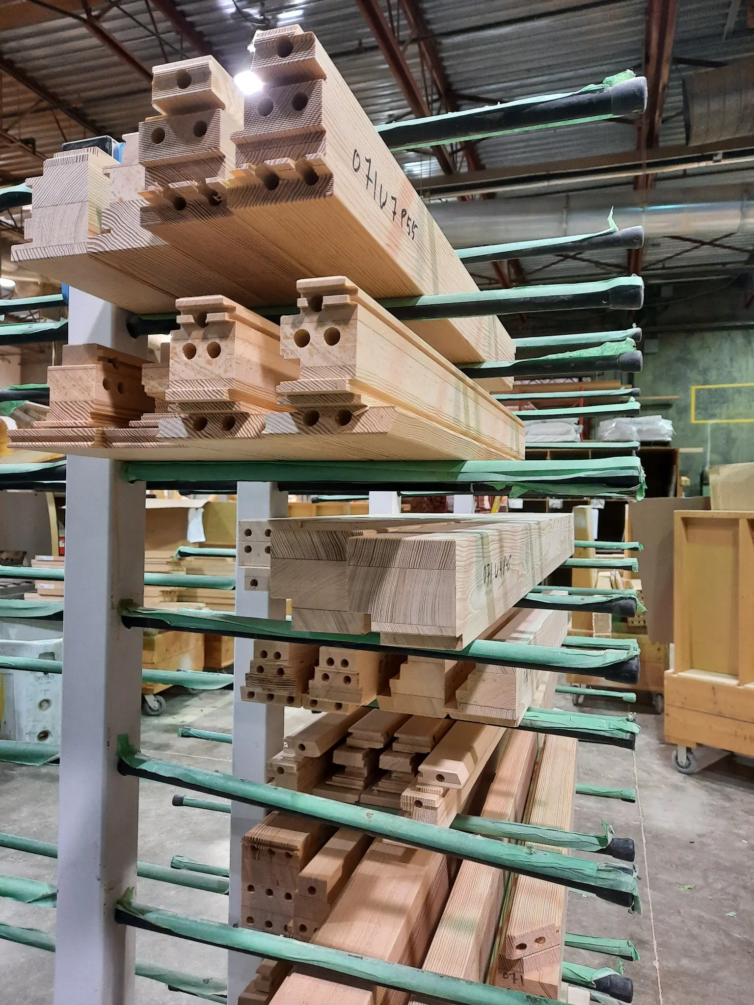 Precisely machined Fenstür wood window components organized for production