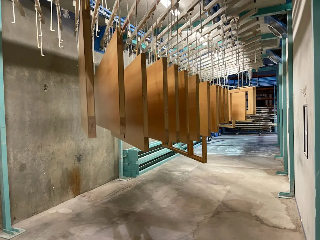 Fenstür wood window and door components moving through the controlled finishing line