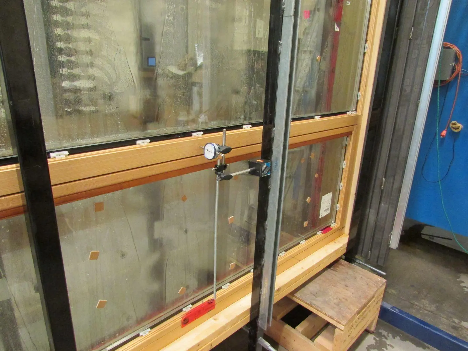 Dial gauge mounted to a Fenstür picture window during structural testing