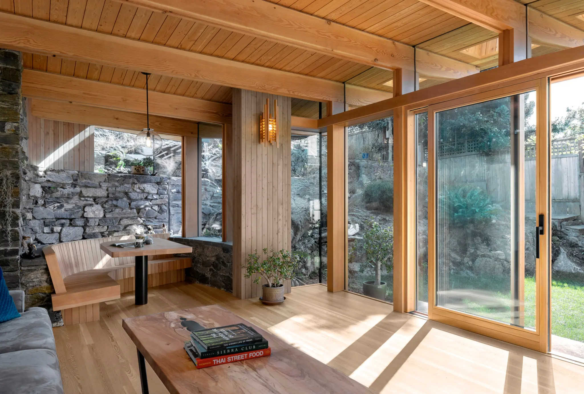 Factory-finished Fenstür wood windows and doors in a warm timber interior