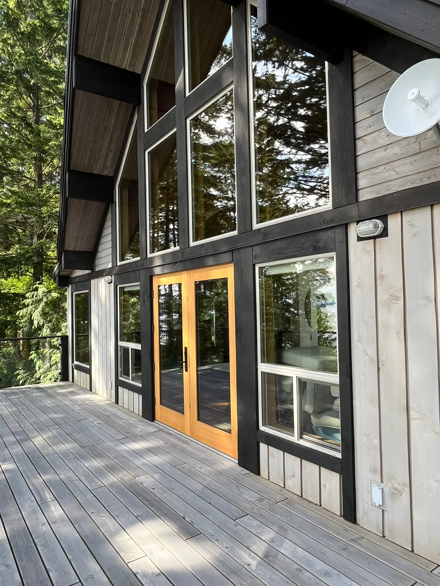 Two-storey window wall and coordinated glazed wood doors