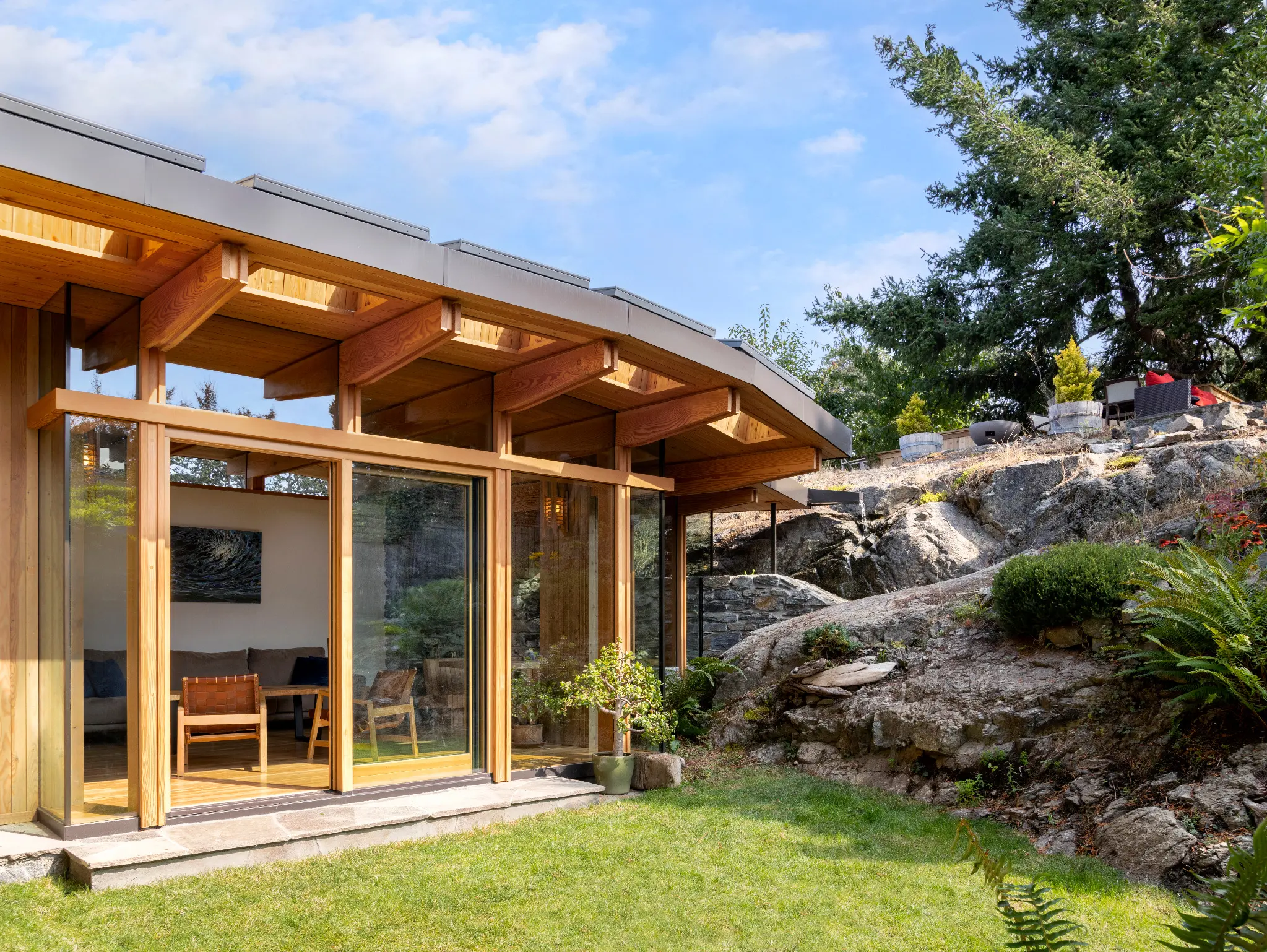 Grotto garden addition in Victoria with custom Fenstür glazing set against exposed rock