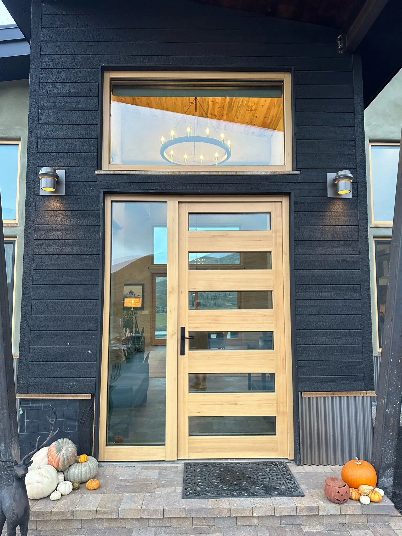 Custom wood entry door with horizontal glazing and sidelite