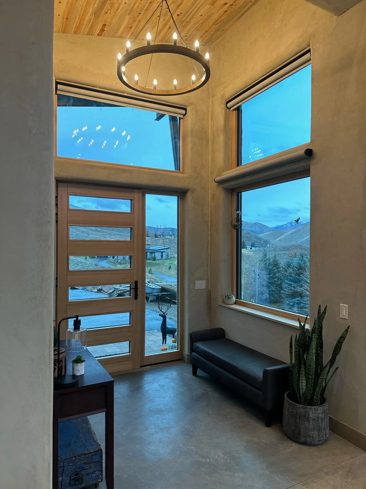 Double-height interior view of the custom wood entrance