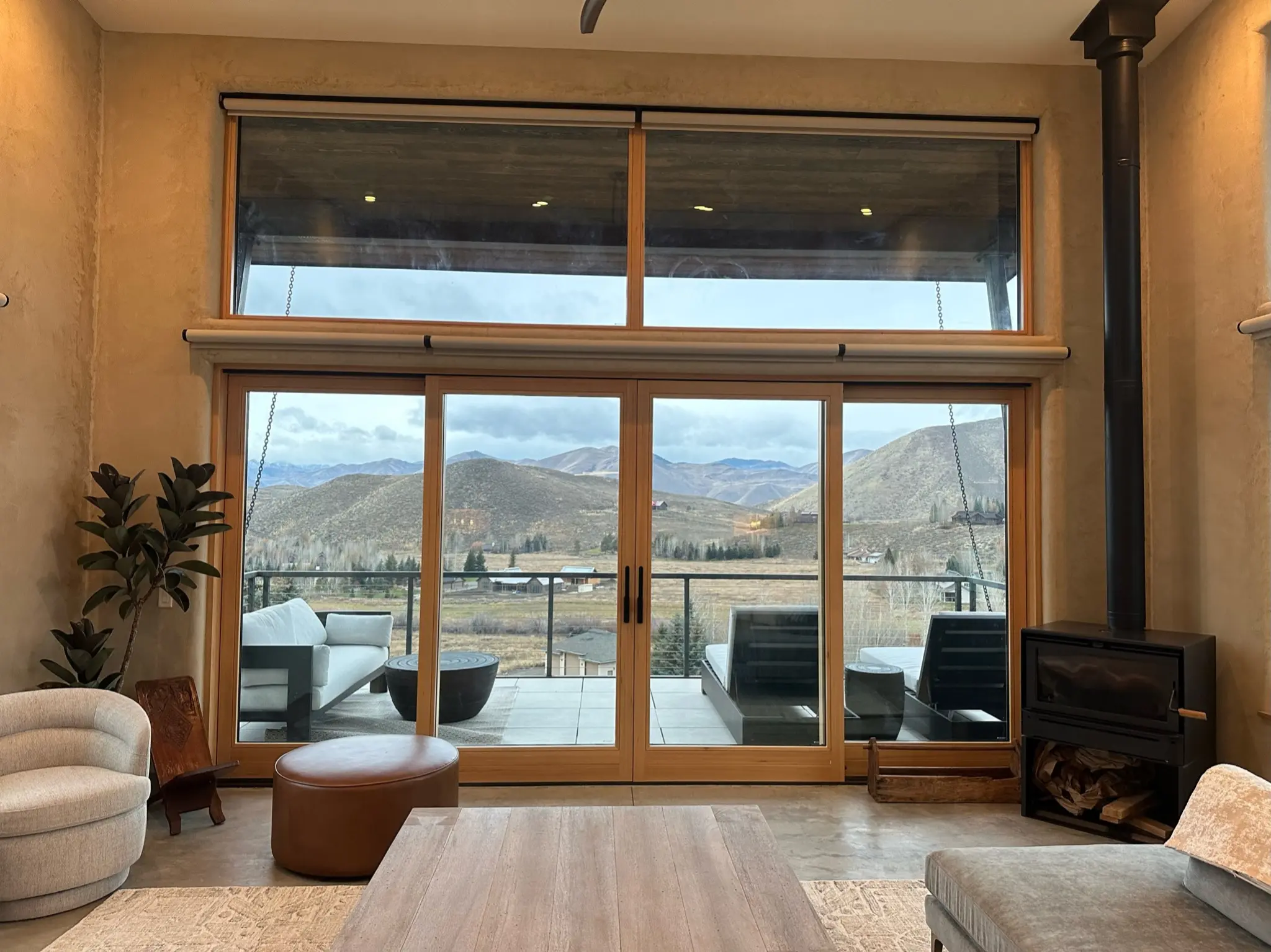 All-wood lift-and-slide opening beneath a broad transom