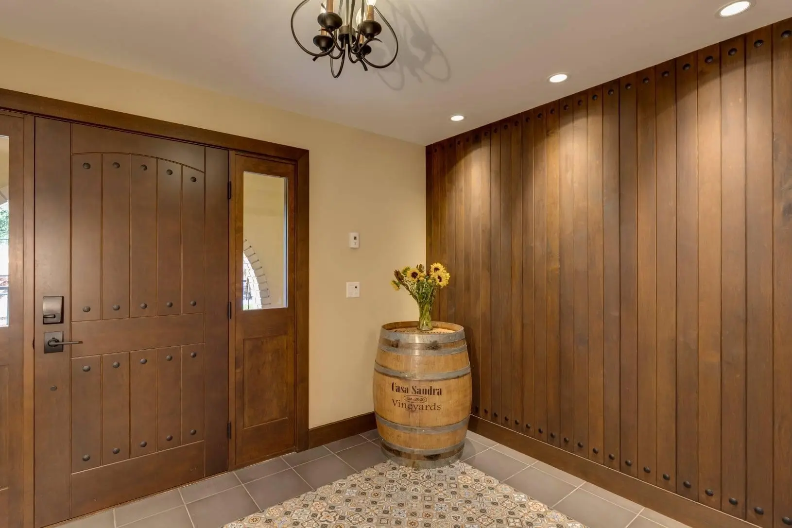 Custom Fenstür winery entrance door with matching wood wall millwork