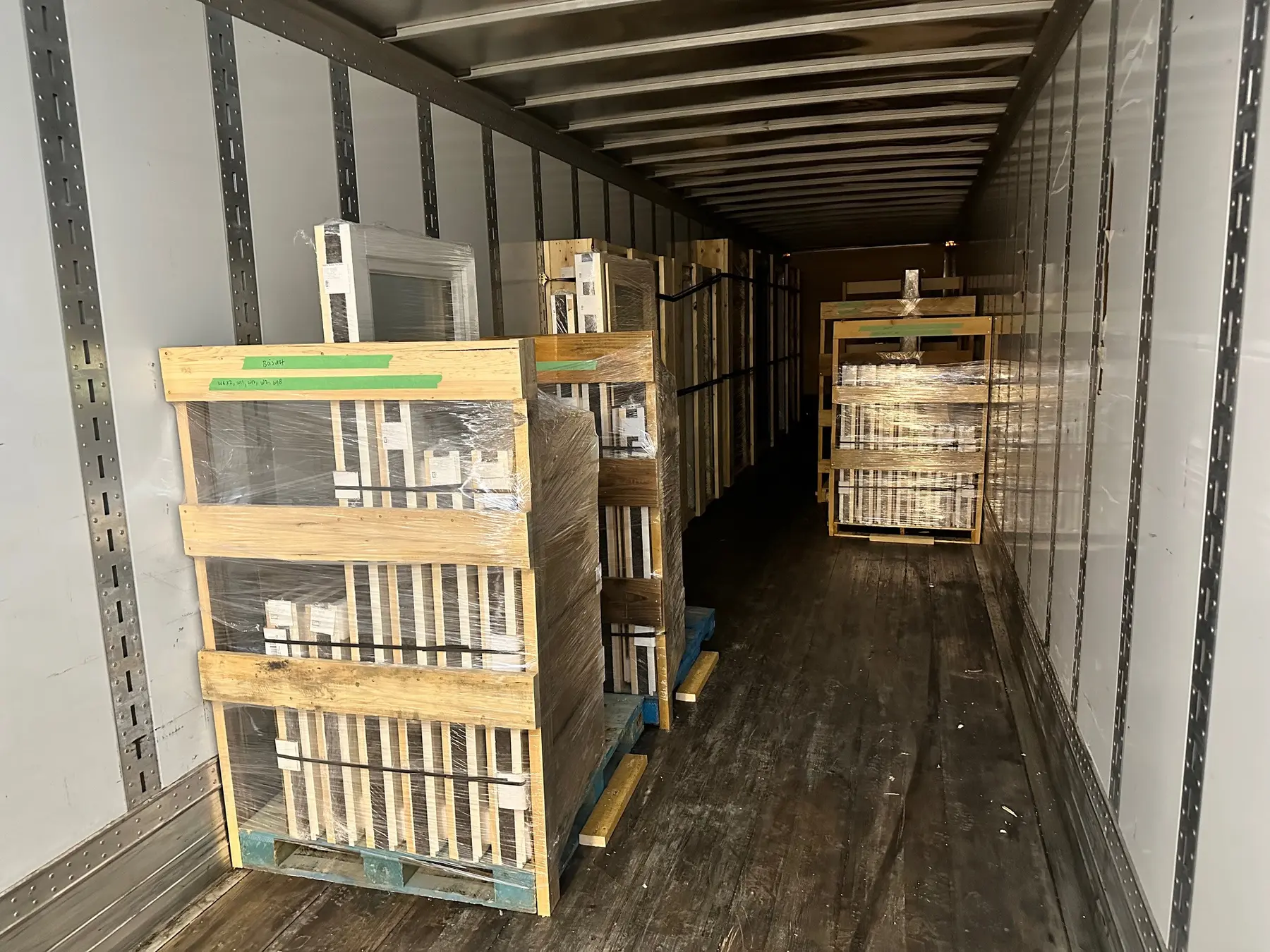 Protected Fenstür windows and doors secured inside a freight trailer